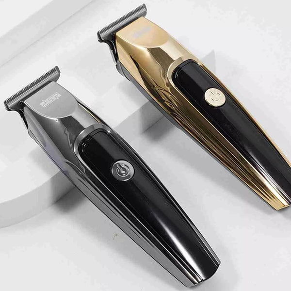 CARATTERISTICHE: Motore: 1700 giri min. Batteria: 600 mha. Durata: 90 min. Tempo di ricarica: 90 min. Cordless: Si. Materiali: Plastica. Colore: Oro e argento. Lama: inox regolabile con rialzi . Rialzi: Si, 4 rialzi (1.5, 3, 6 e 9 mm).. Utilizzabile con e senza filo: Si Display: Si.